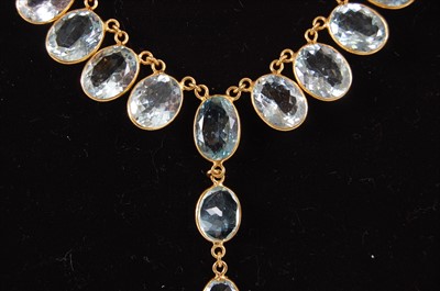 Lot 2195 - A contemporary yellow metal and aquamarine...