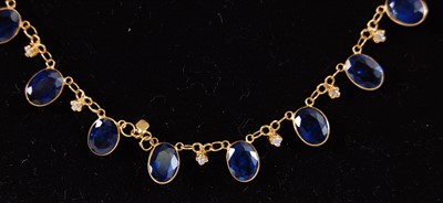 Lot 2221 - A contemporary yellow metal, sapphire and...