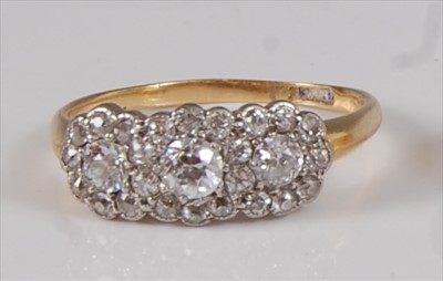 Lot 2189 - A 14ct gold diamond cluster ring, arranged as...