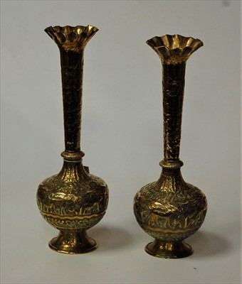 Lot 9 - A pair of Indian brass vases, each having a...