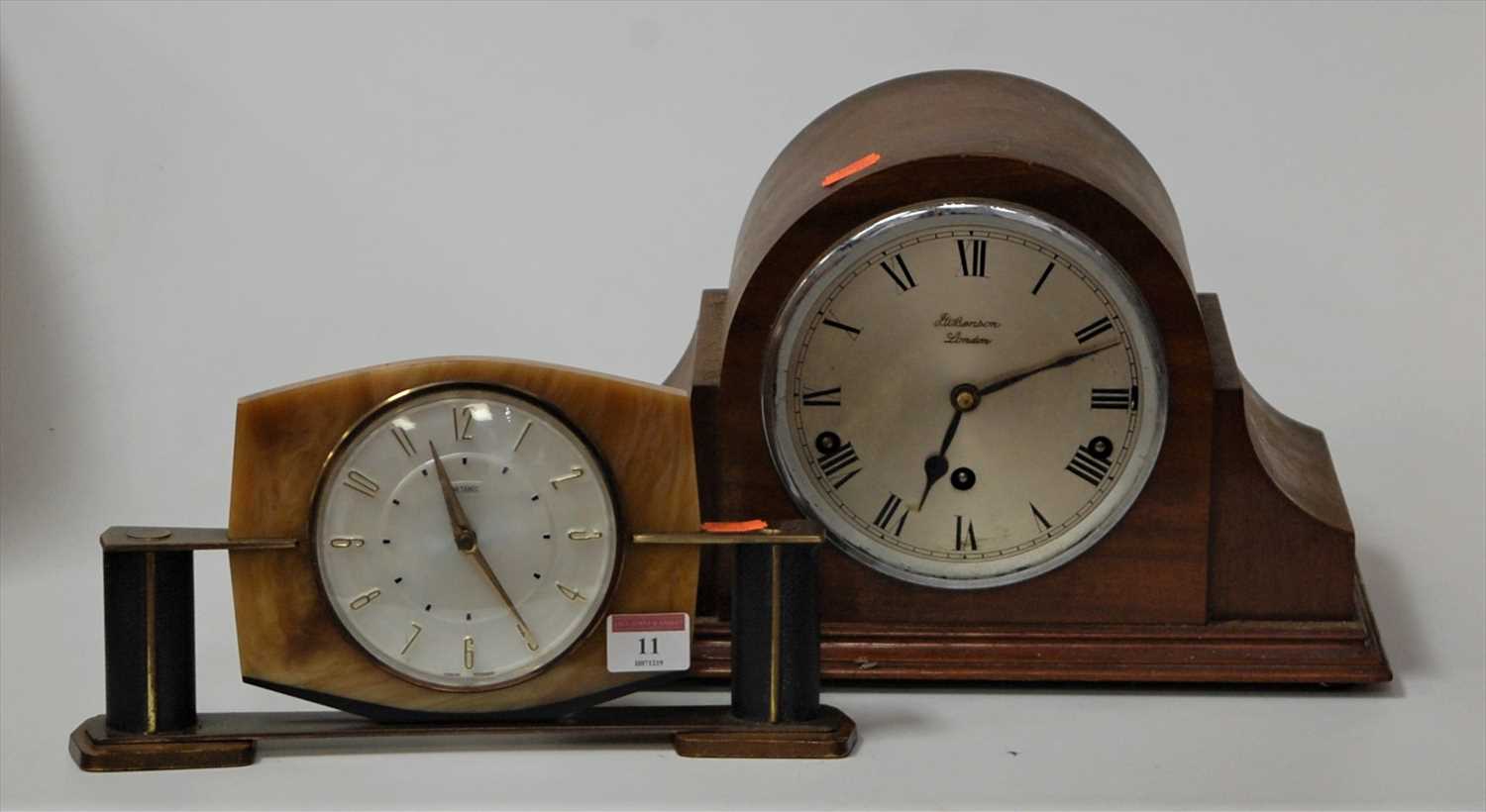 Lot 11 - A 1920s mahogany cased mantel clock, the...
