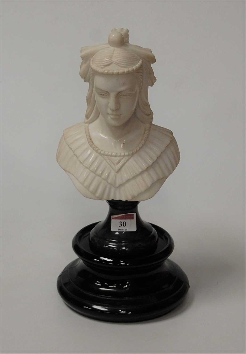Lot 34 - A carved marble female head and shoulders bust...
