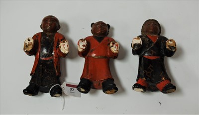 Lot 52 - A set of three carved softwood and polychrome...