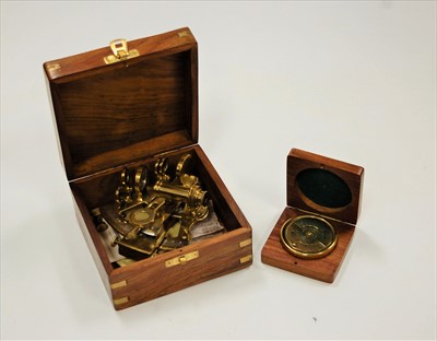 Lot 64 - A reproduction miniature brass sextant in...