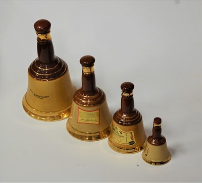 Lot 65 - A Wade Bells Scotch Whisky bell together with...