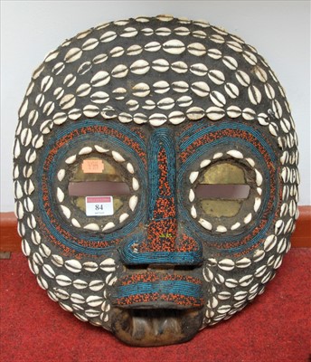 Lot 84 - A large souvenir tribal wall mask having...