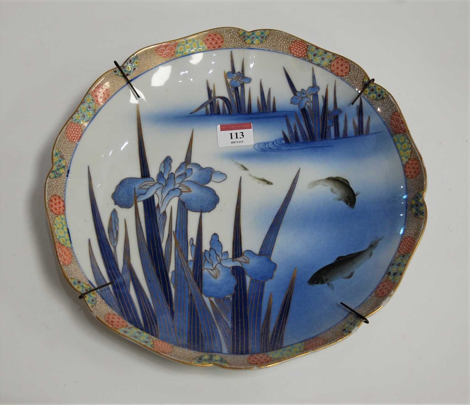 Lot 113 - A Japanese charger of scalloped circular form,...