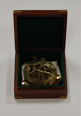 Lot 124 - A reproduction brass sundial in fitted case