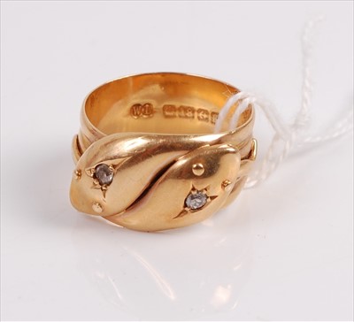 Lot 305 - An 18ct gold snake ring modelled as two...