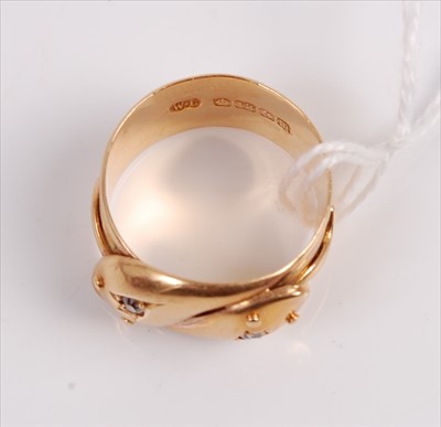 Lot 305 - An 18ct gold snake ring modelled as two...