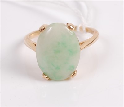 Lot 306 - A 14ct gold and cabochon spinach jade set...