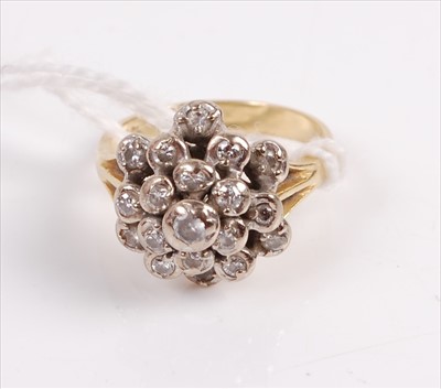 Lot 308 - An 18ct gold diamond cluster ring in a tiered...