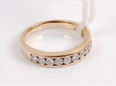 Lot 309 - A modern 9ct gold diamond half eternity ring...