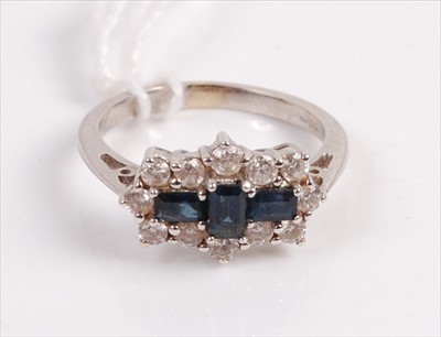 Lot 312 - A contemporary 18ct white gold sapphire and...