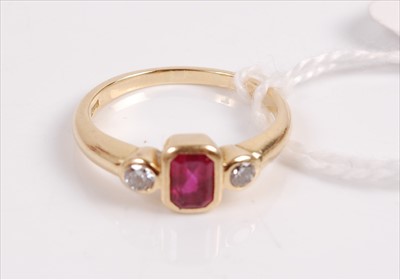 Lot 318 - A 18ct gold ruby and diamond ring, the centre...