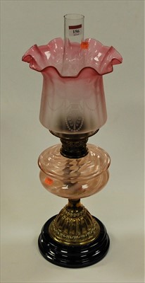 Lot 156 - A Victorian pedestal oil lamp having cranberry...