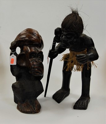 Lot 147 - A souvenir African carved ebony tribal figure,...