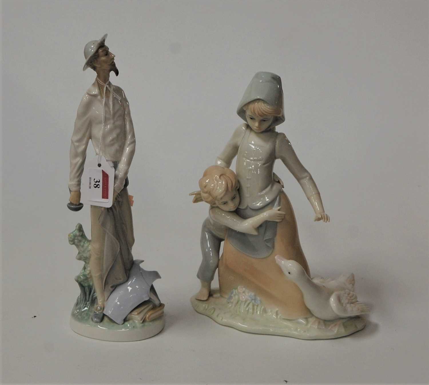Lot 38 - A Spanish porcelain figure group of two...