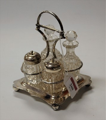 Lot 260 - An Edwardian silver four bottle cruet,...