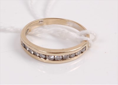 Lot 322 - A yellow metal diamond set half eternity ring...