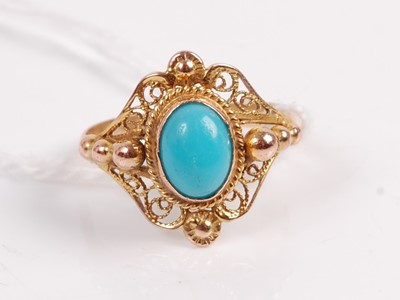 Lot 325 - A yellow metal turquoise set dress ring, the...