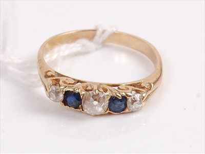 Lot 327 - A yellow metal sapphire and diamond dress ring,...