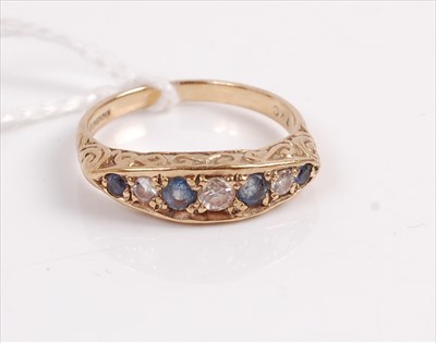 Lot 328 - A 9ct gold sapphire and diamond dress ring,...