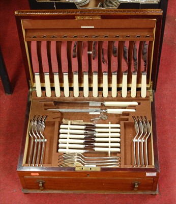 Lot 555 - A mahogany cased twelve place setting canteen...