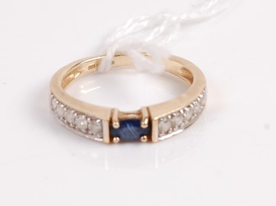 Lot 329 - A contemporary 9ct gold sapphire and diamond...
