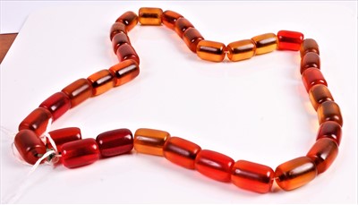 Lot 332 - A faux cherry amber beaded necklace, 72cm