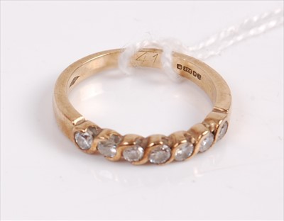 Lot 332a - A contemporary 9ct gold diamond half eternity...