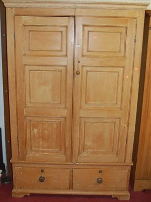 Lot 1110 - A reclaimed pine double door wardrobe, over...