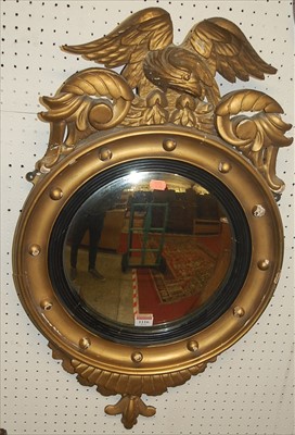 Lot 1116 - A 19th century giltwood circular convex wall...