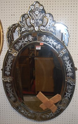 Lot 1117 - A Venetian floral etched oval bevelled wall...