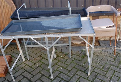 Lot 1128 - Two aluminium plant tables; together with a...