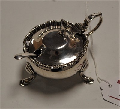 Lot 562 - An Edwardian silver mustard, of squat circular...