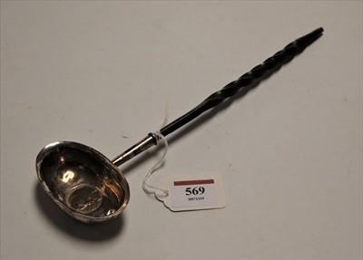 Lot 569 - A George III white metal toddy ladle, inset...