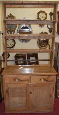 Lot 1133 - A pine narrow kitchen dresser, the three-tier...