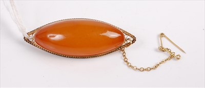 Lot 368 - A middle eastern cabochon orange stone and...