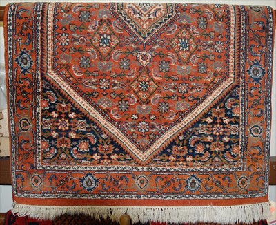 Lot 1159 - A small Persian red ground woollen rug, 115 x...