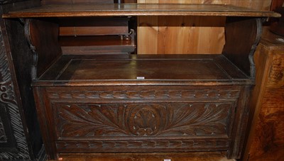 Lot 1196 - An early 20th century line relief carved oak...