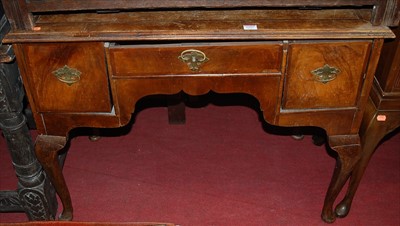 Lot 1197 - An early 20th century figured walnut three...