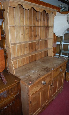 Lot 1179 - A pine kitchen dresser, the three-tier open...