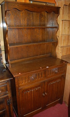 Lot 1181 - A contemporary moulded oak linenfold narrow...