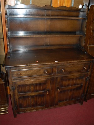 Lot 1182 - A contemporary moulded oak linenfold panelled...