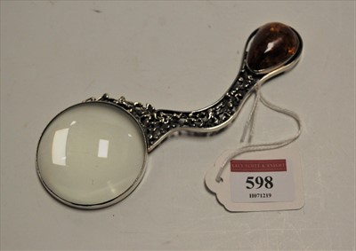 Lot 598 - A continental white metal magnifying glass,...