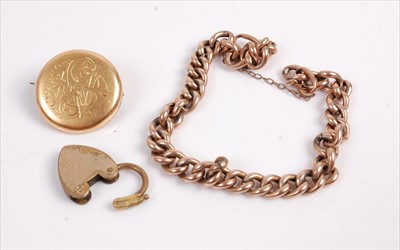 Lot 380 - A gilt metal curblink bracelet, with heart...