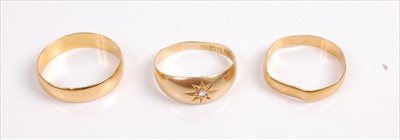 Lot 388 - Two 22ct gold wedding bands, 5g; and one 18ct...