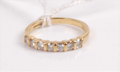 Lot 392 - An 18ct gold diamond half eternity ring, the...