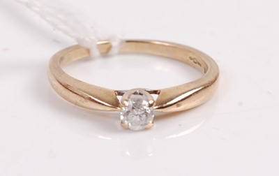 Lot 394 - A 9ct gold diamond solitaire ring, the four...